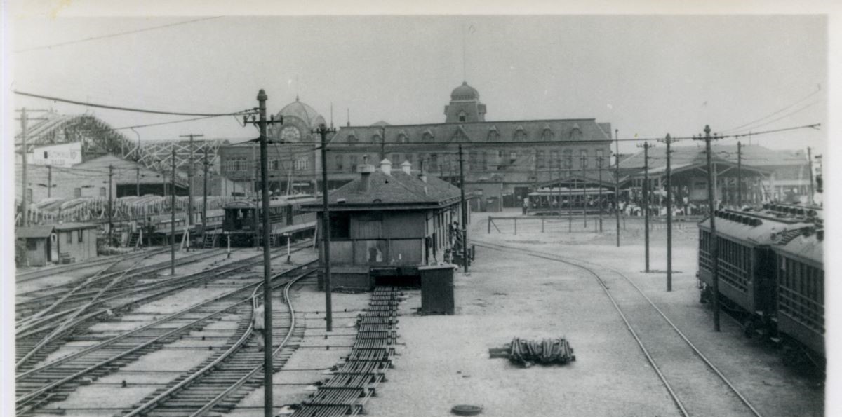Train tracks terminate at Coney Island. Cyclone seen in back left. 1916