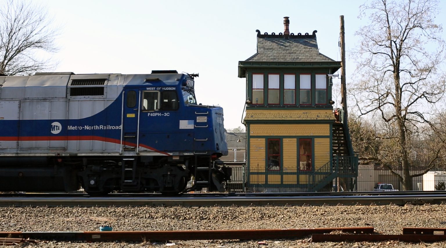 Waldwick signal tower with Metro North train crossing from the left.