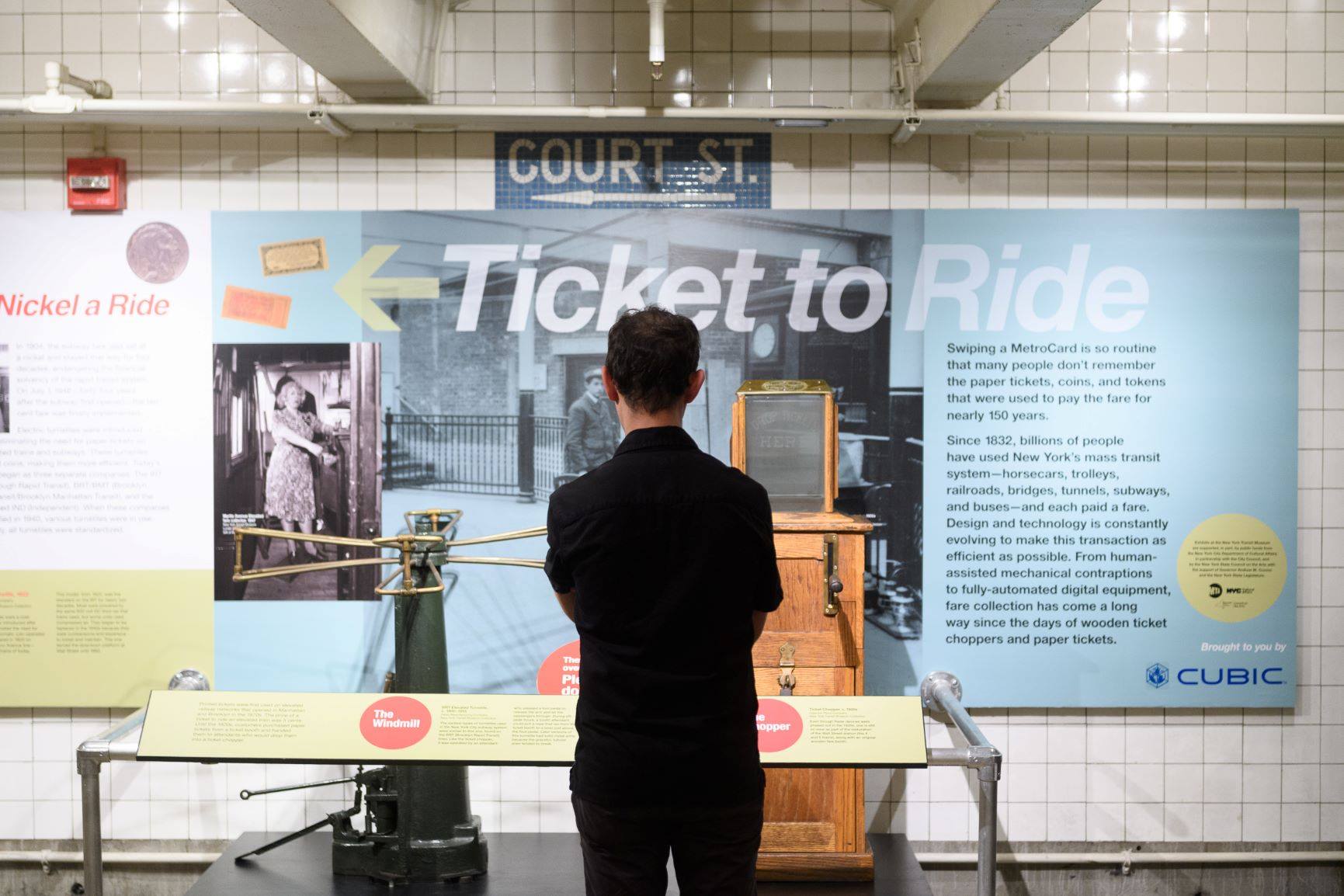 Visitor viewing Ticket to Ride exhibit